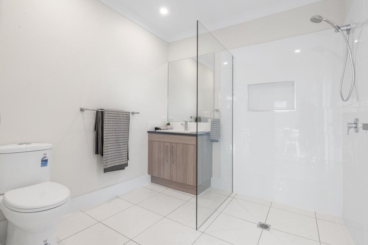 Modern private ensuite with walk-in shower.